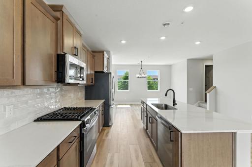 Another view of kitchen. Photo of previous model home, options and color selections may vary.