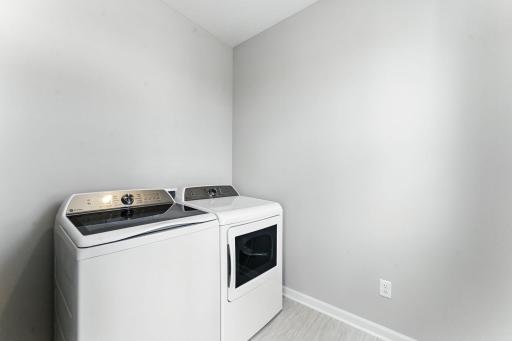 Laundry Room. Photo of previous model home, options and color selections may vary.