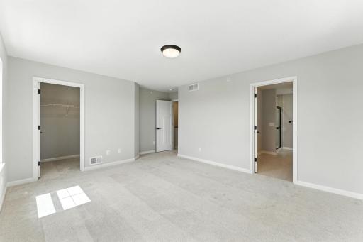 Owners Suite with Plus Carpet and Ample Space for Large Furniture. Photo of previous model home, options and color selections may vary.