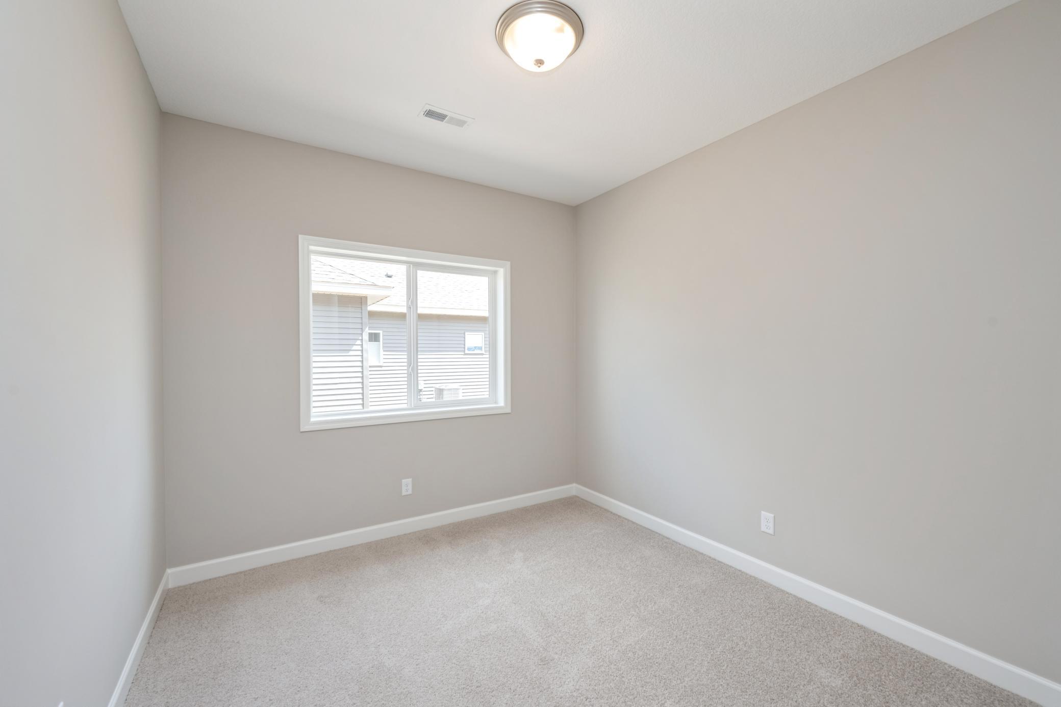 Bedroom 2 - photos are of a completed inventory home of the same floorplan. Colors and selections may differ.