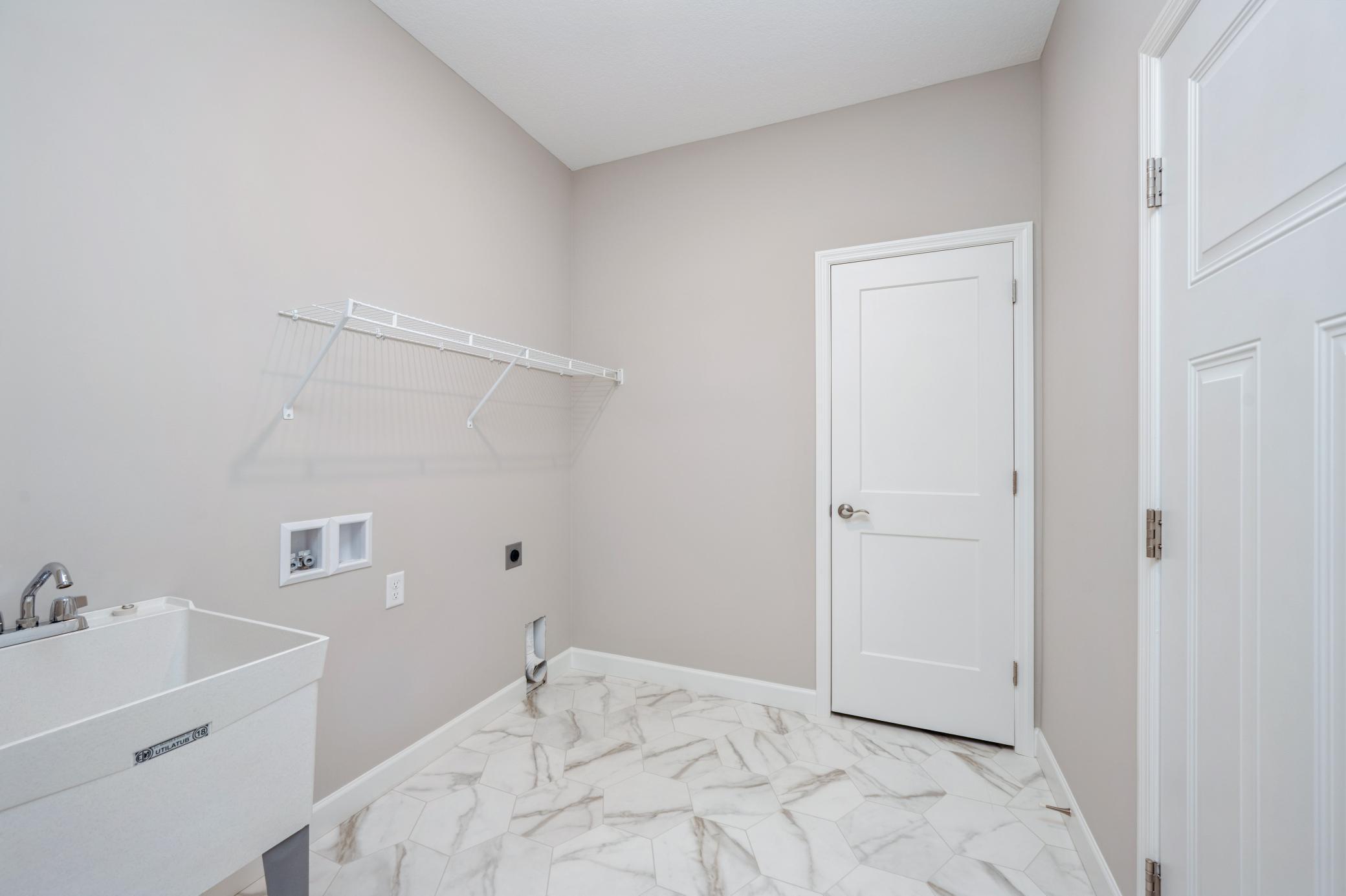 Mud/Laundry room - photos are of a completed inventory home of the same floorplan. Colors and selections may differ.