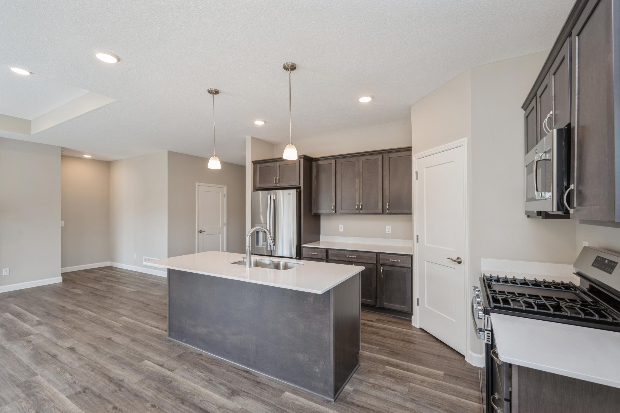 Kitchen - photos are of a completed inventory home of the same floorplan. Colors and selections may differ.