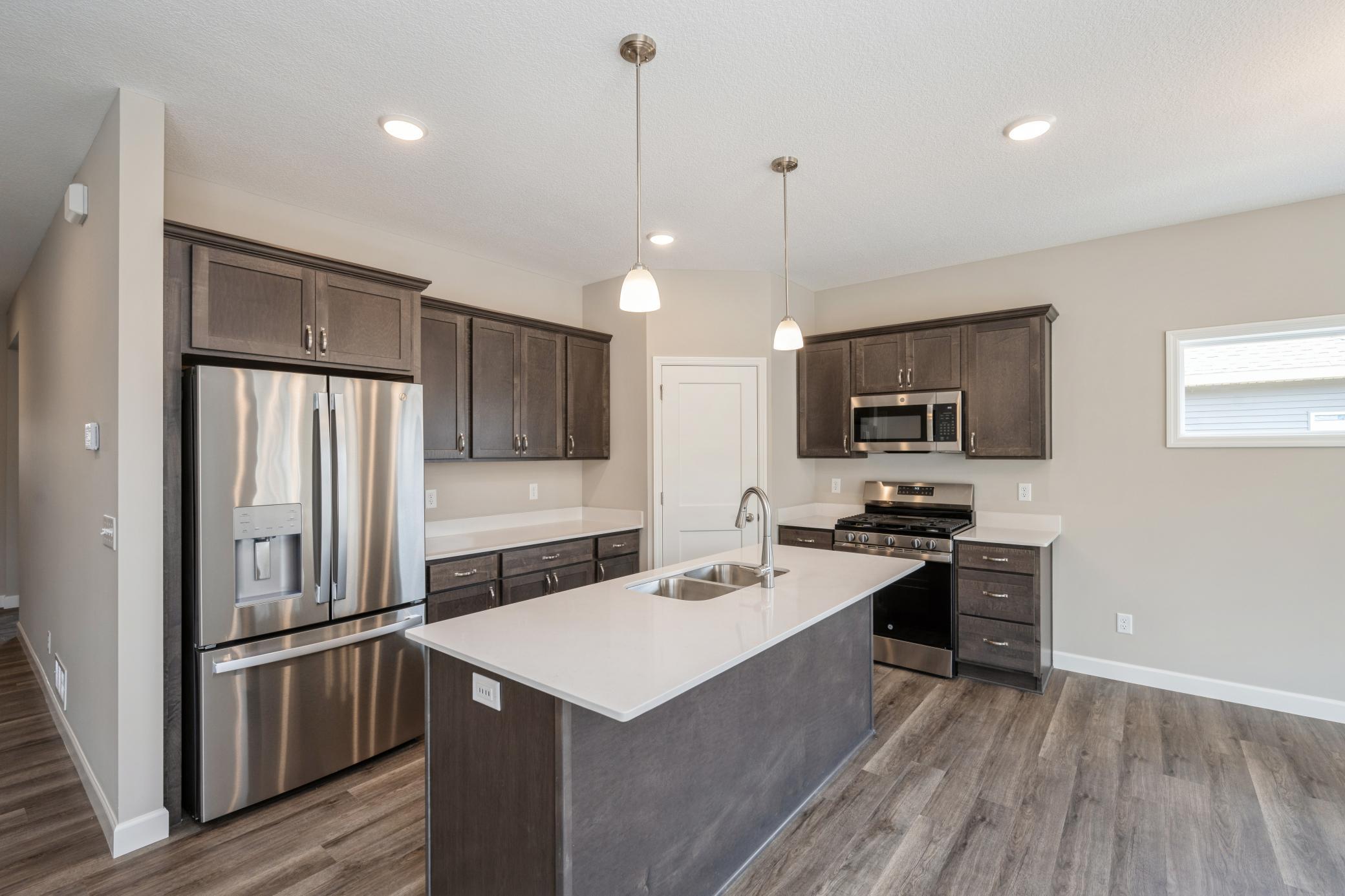 Kitchen - photos are of a completed inventory home of the same floorplan. Colors and selections may differ.