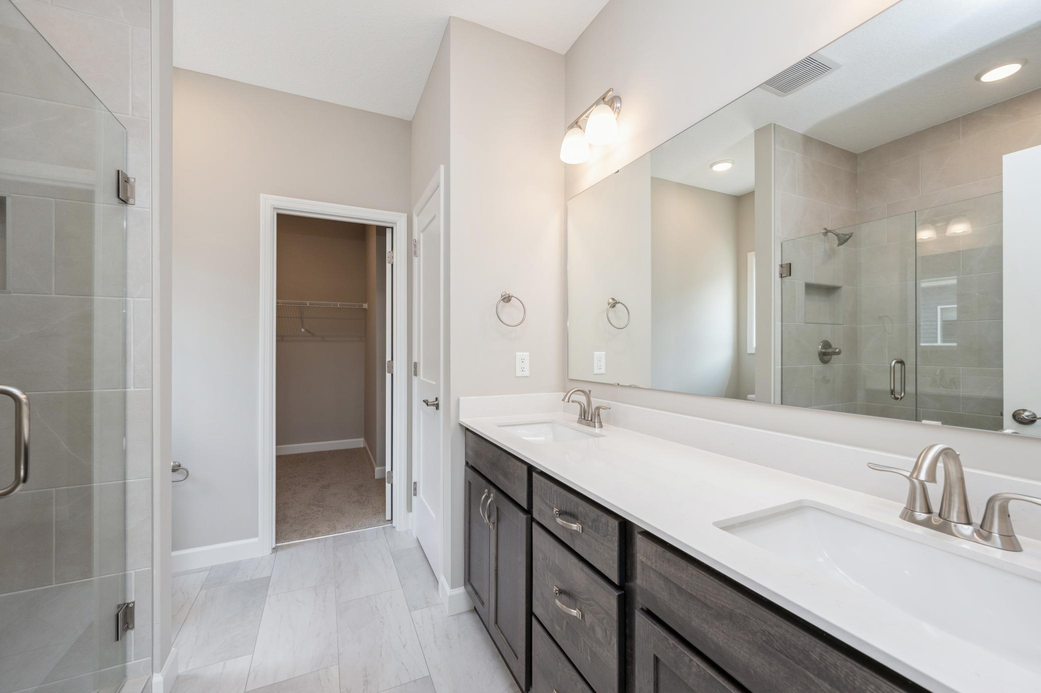Primary suite luxury bathroom - photos are of a completed inventory home of the same floorplan. Colors and selections may differ.
