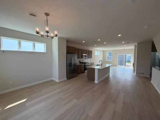 In this open floor plan, the dinette, kitchen, and living room flow flawlessly to keep everyone connected.