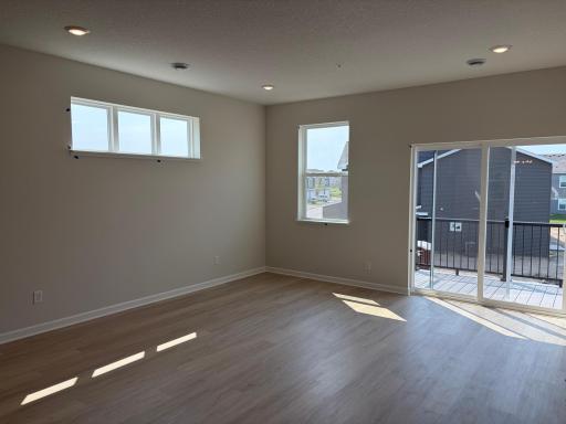 A reverse look at the living room shows even more windows for excellent lighting.