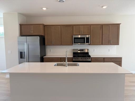 Welcome to the Capri! An open and inviting home, this homeâs kitchen features an oversized island and all the kitchen appliances. With plenty of seating for those on the go for the early mornings!