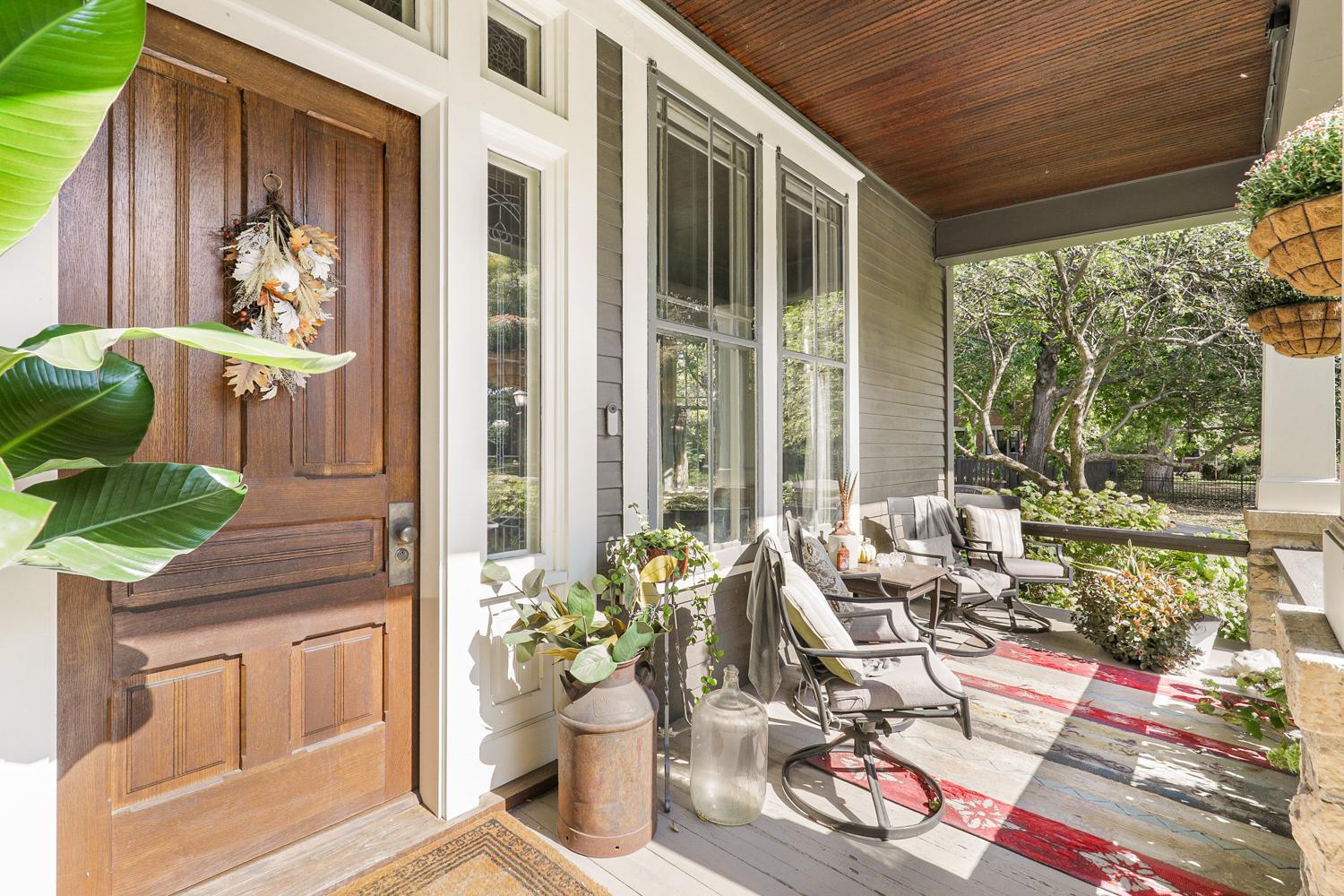 Front Entry and Porch, note the hand crafted front door created to match home's history and Design.,