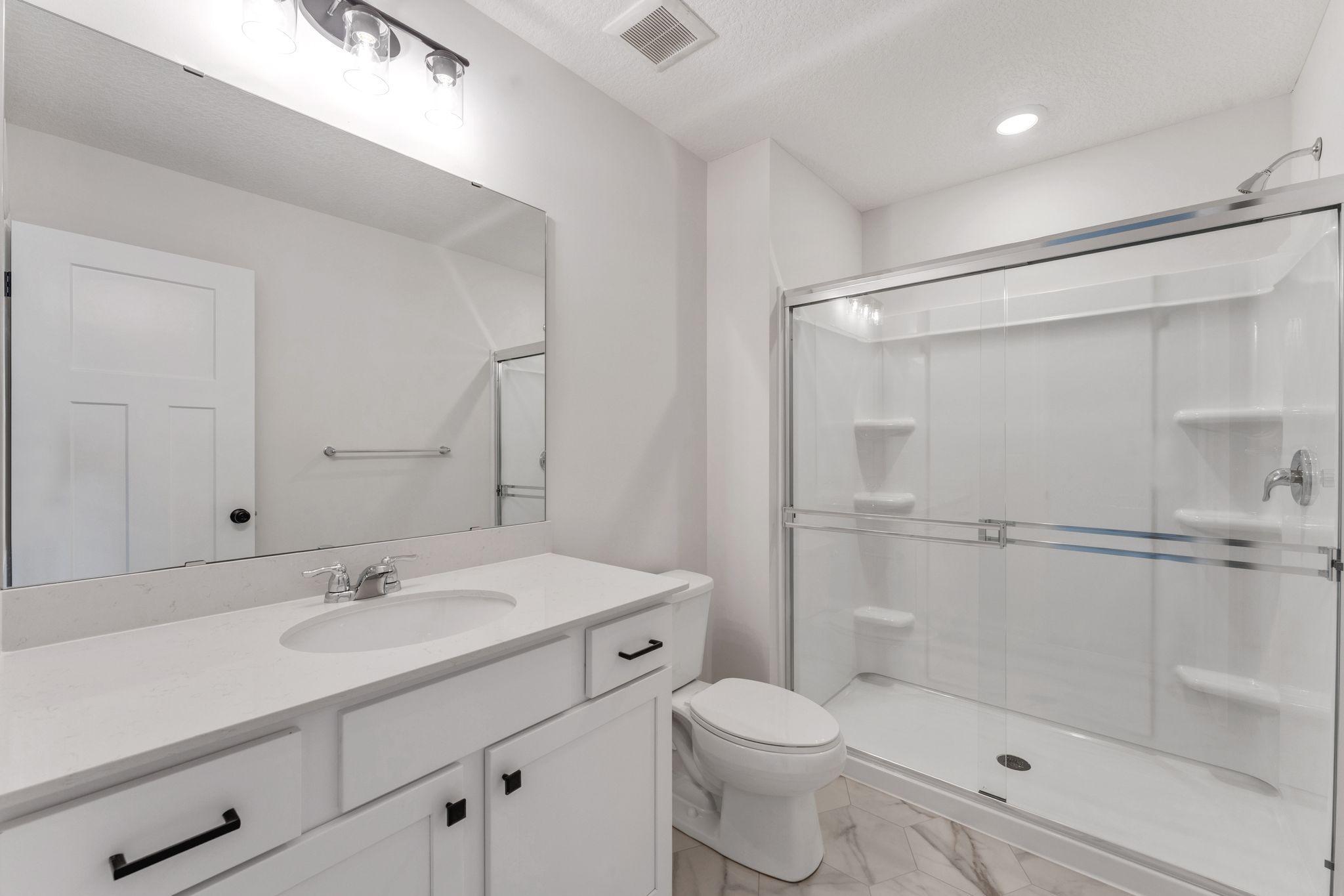 Private owner's bath with a thoughtful design. Photo is for representational purposes only, not the actual home.