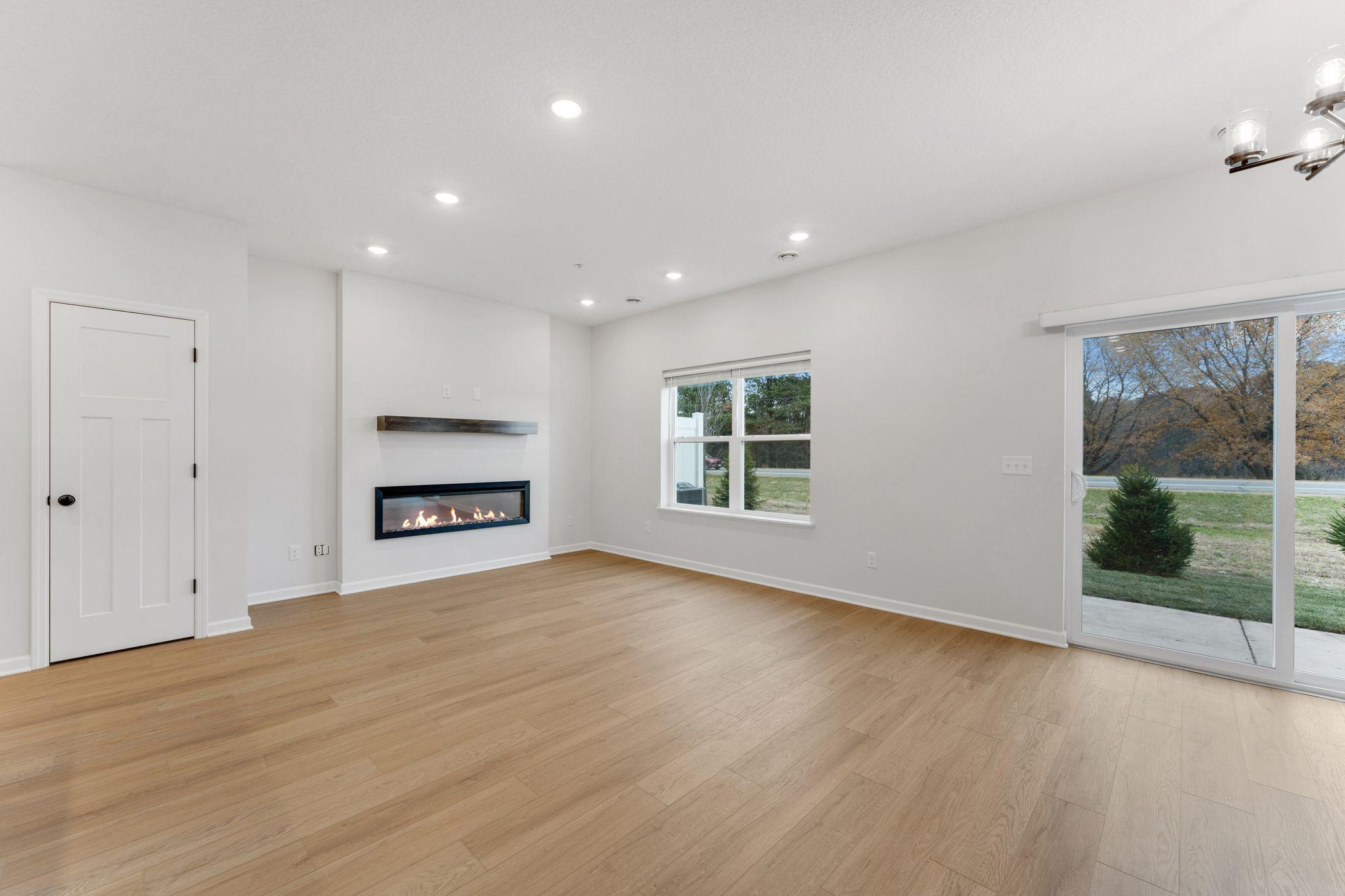 Bright, open living room designed for comfortable everyday living. Photo is for representational purposes only, not the actual home.