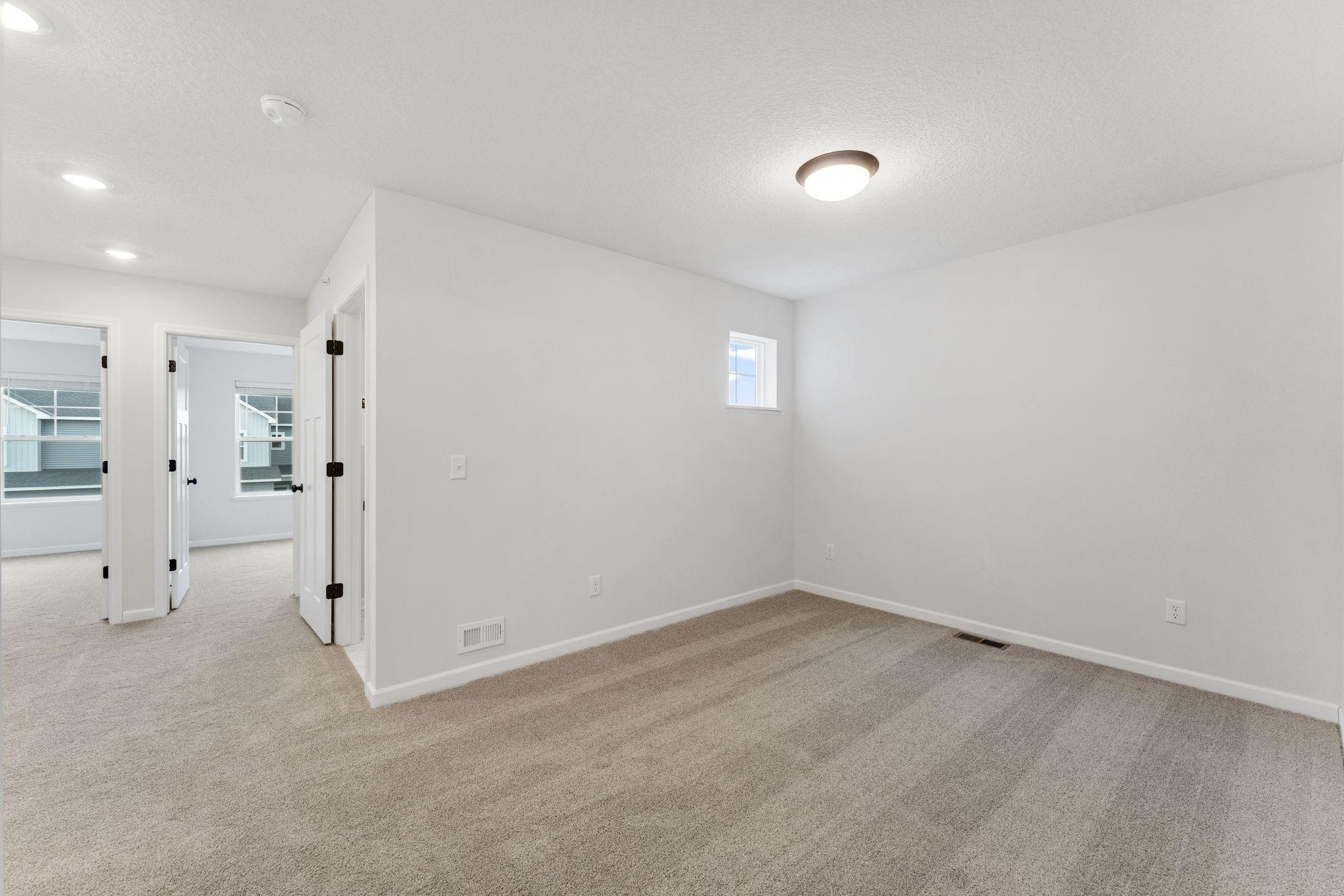 Versatile loft space perfect for relaxing, working, or entertaining. Photo is for representational purposes only, not the actual home.