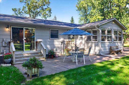 Spacious rear patio provides the perfect setting for outdoor dining, entertaining, and enjoying the beautiful backyard.