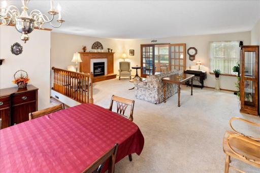 Beautifully maintained, open living and dining areas offer plenty of space for everyday comfort and entertaining, highlighted by a cozy gas fireplace.