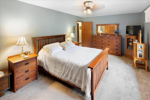 Another view of the generously sized bedroom, showcasing its comfortable layout with plenty of room for bedroom furniture and additional furnishings.