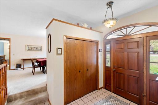 Spacious entryway with attractive woodwork, convenient coat closet, and easy access to the main living areas.