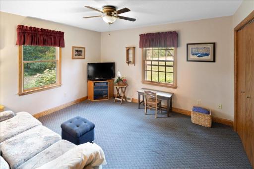 Spacious and inviting second bedroom featuring two windows that provide abundant natural light and beautiful views of the surrounding yard. Offers plenty of flexibility for use as a bedroom, guest room, or home office.