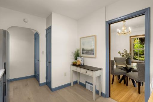 Original kitchen has updated floors, pantry with another clothes chute as well as a door to the backyard and the basement.