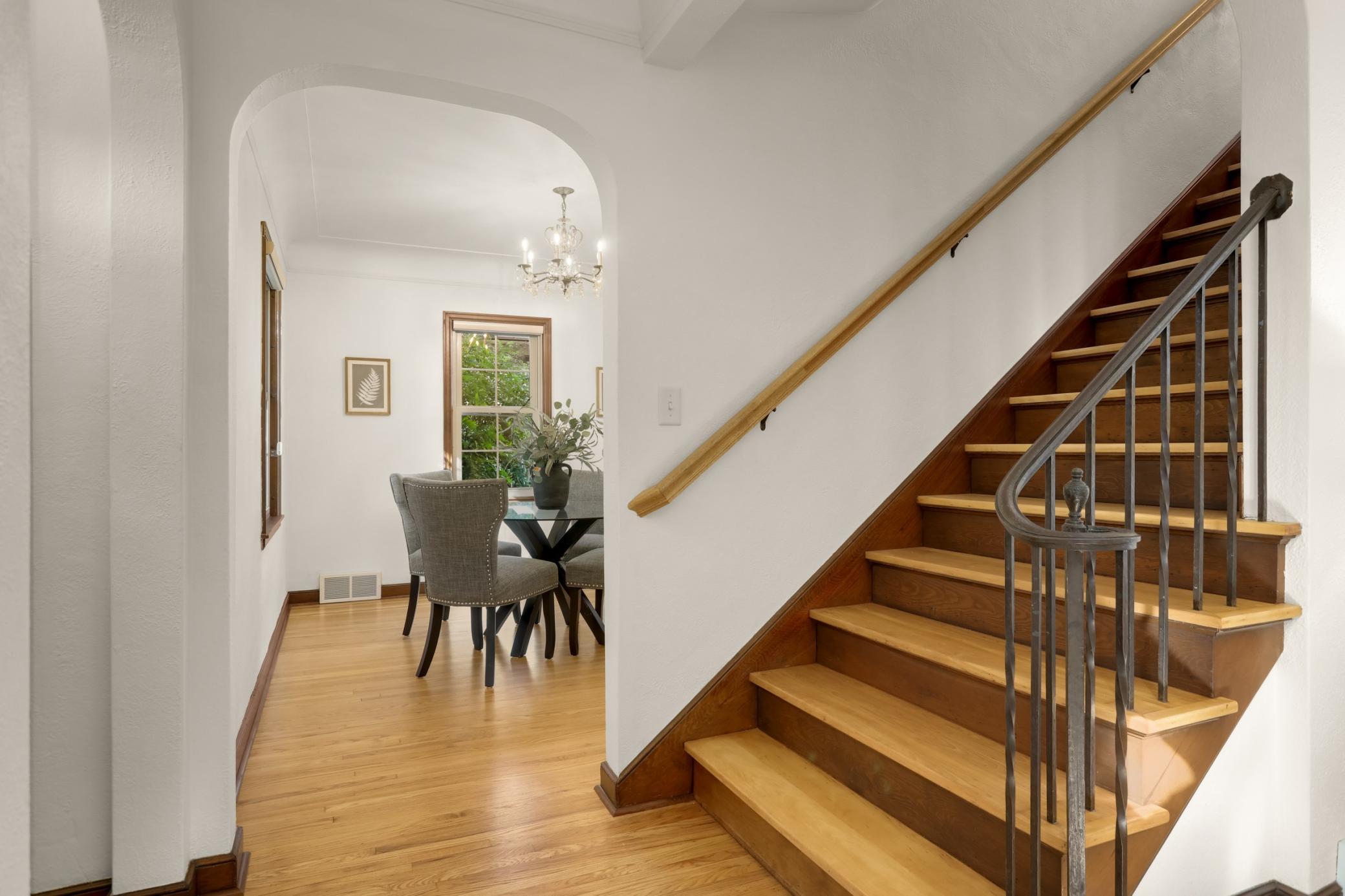The dining room is just to the left of the staircase and flows right into the kitchen.