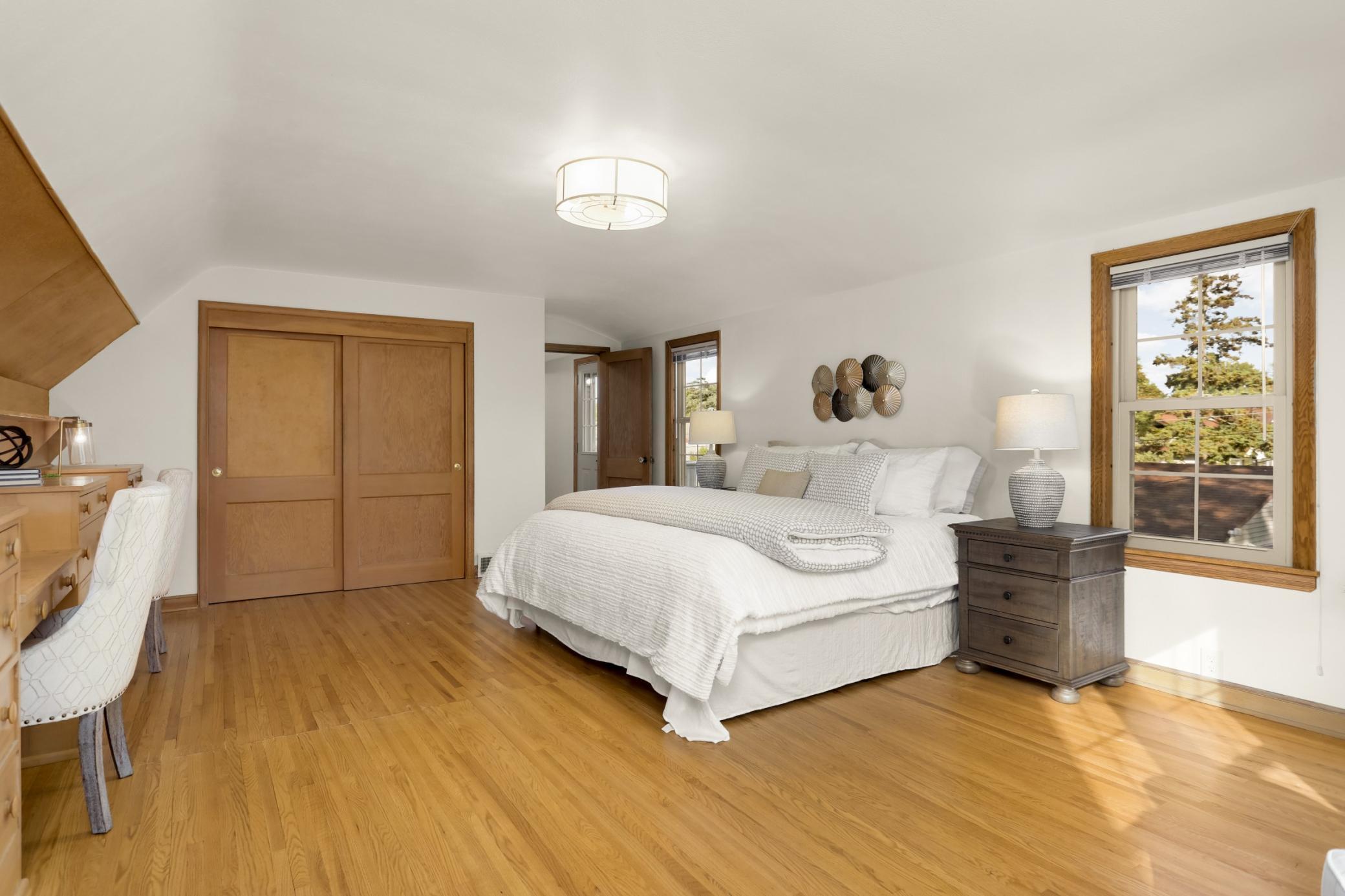 More storage can be found in this spacious, light filled bedroom.