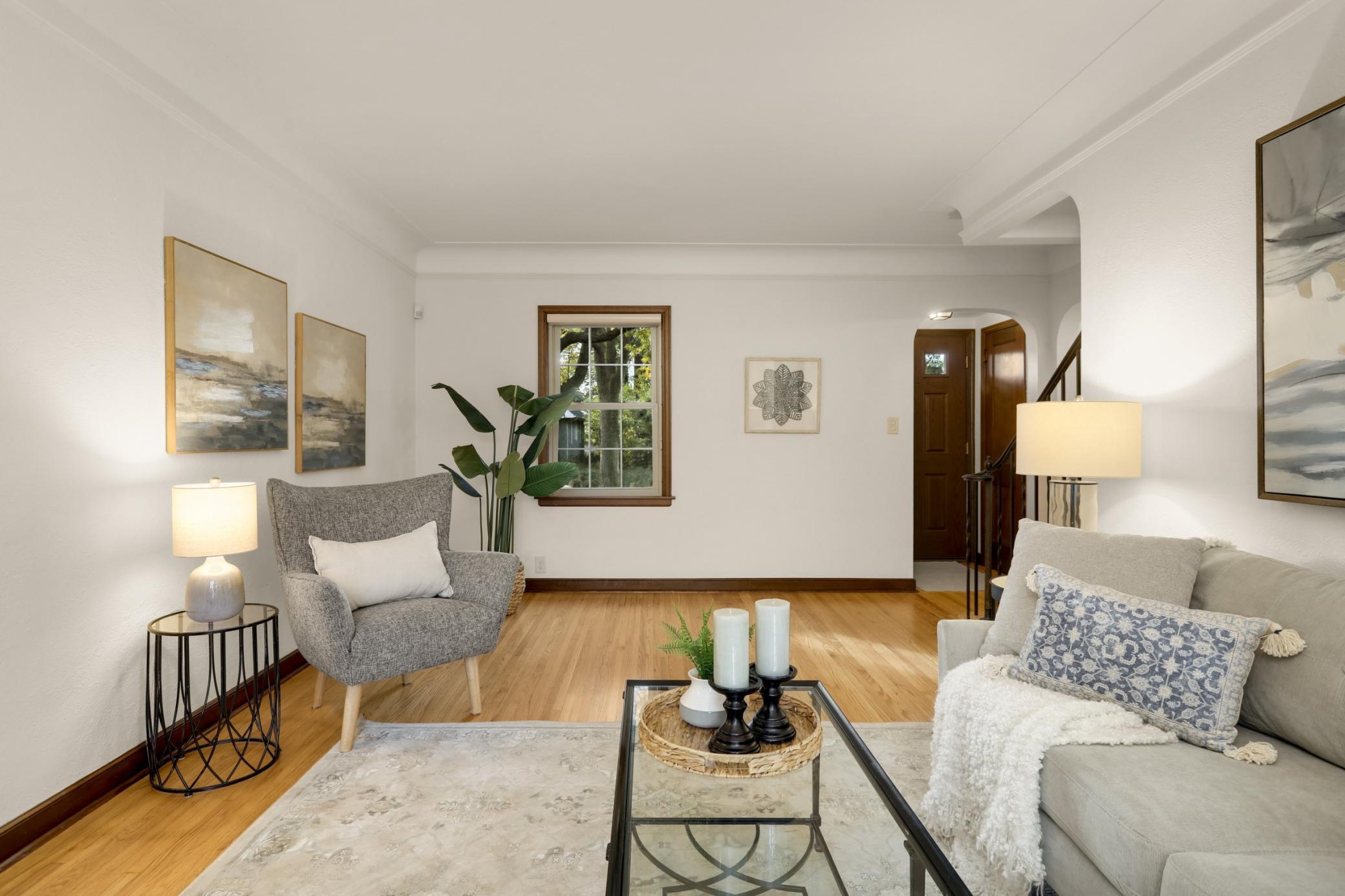 This large living room allows for many furniture configurations. There is a convenient foyer with a bench for shoe removal as well as a closet for coats.