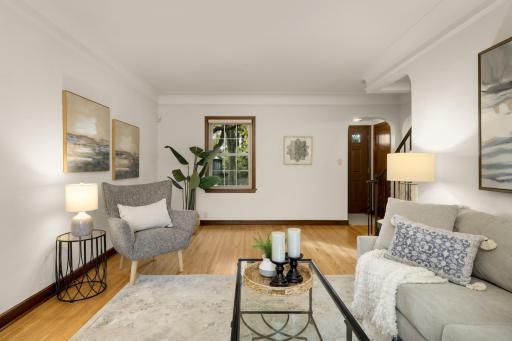 This large living room allows for many furniture configurations. There is a convenient foyer with a bench for shoe removal as well as a closet for coats.