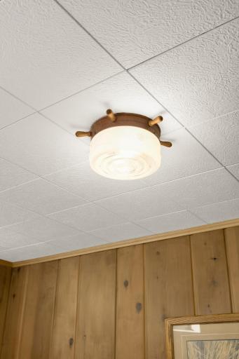 Mid-century nautical light fixture found throughout the lower level finished rooms. Absolutely fabulous!