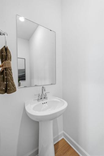 In a discreet location on the first floor is a convenient powder room to accommodate the needs of the whole household and visiting guests.