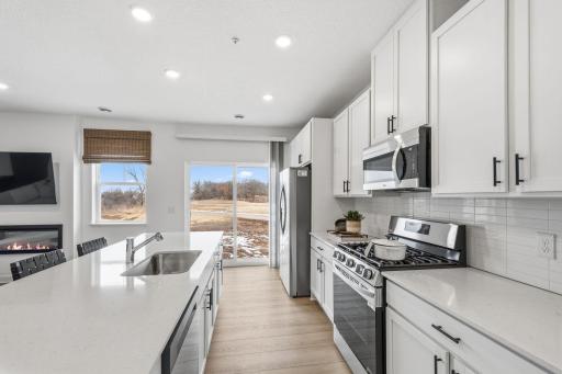 Open the sliding glass-doors to welcome a refreshing breeze throughout the interior or venture out to the patio for a breath of fresh air