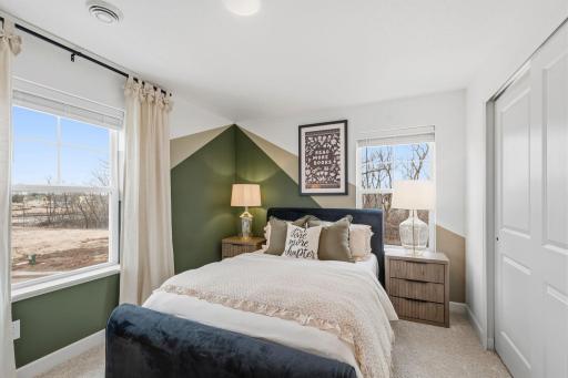All bedrooms in the home include plush wall-to-wall carpeting and practical wardrobe closets