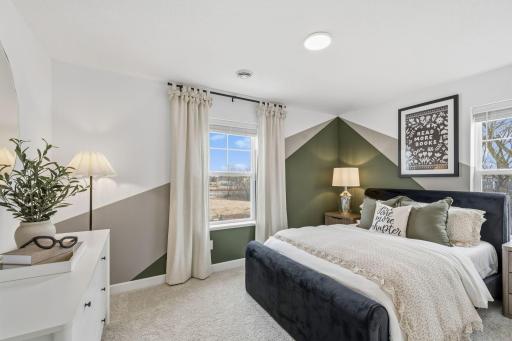 The two secondary bedrooms can be found on the top level to provide a quiet haven away from the bustling downstairs main living area.