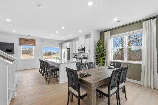 Sharing space with the kitchen, the modern dining area is great for serving piping-hot meals during intimate family dinners and holiday parties.