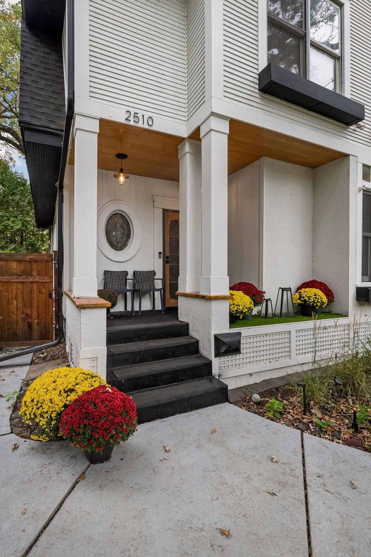 Updated front porch with new ceiling lighting and security door.