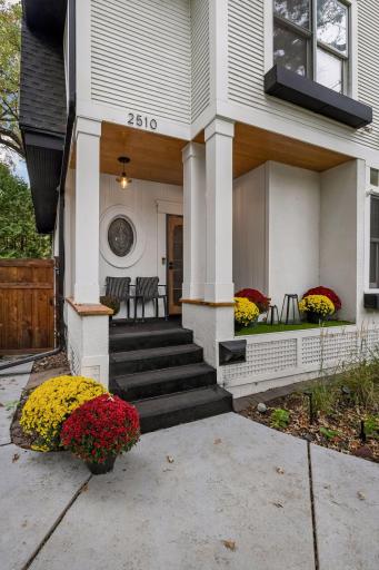 Updated front porch with new ceiling lighting and security door.