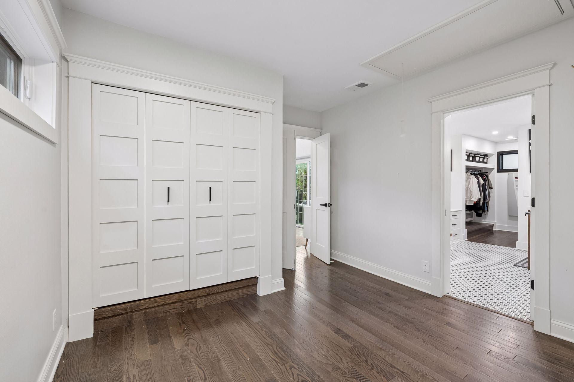 Primary suite offers excellent storage with separate his-and-hers closets.