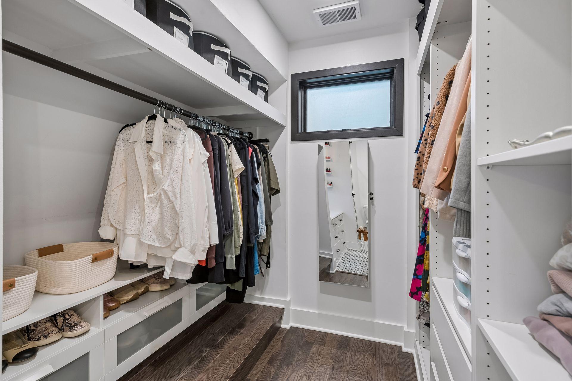 One of two separate primary closets provides exceptional built-in storage.
