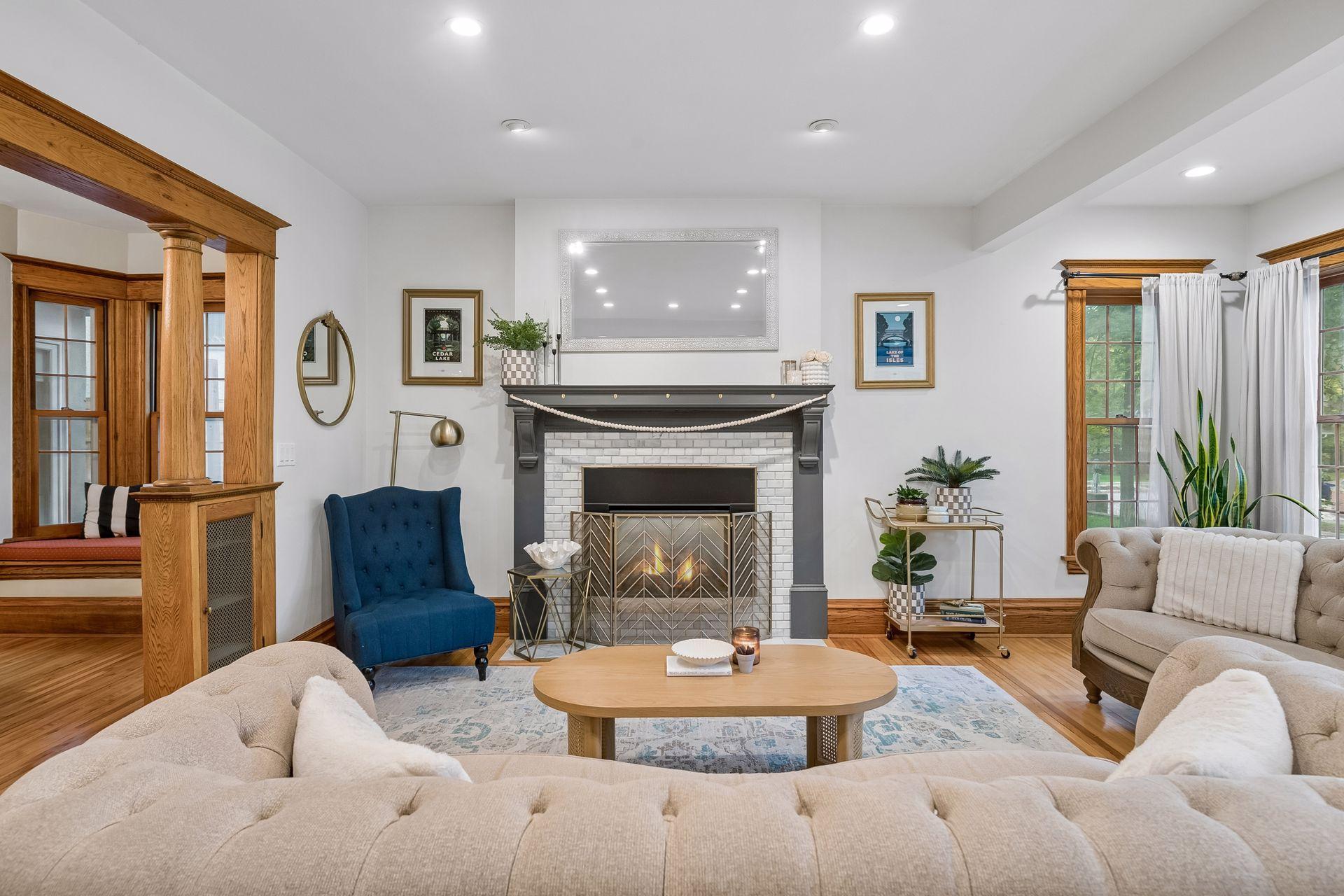 Updated fireplace features a new mantel, tile surround and hearth.