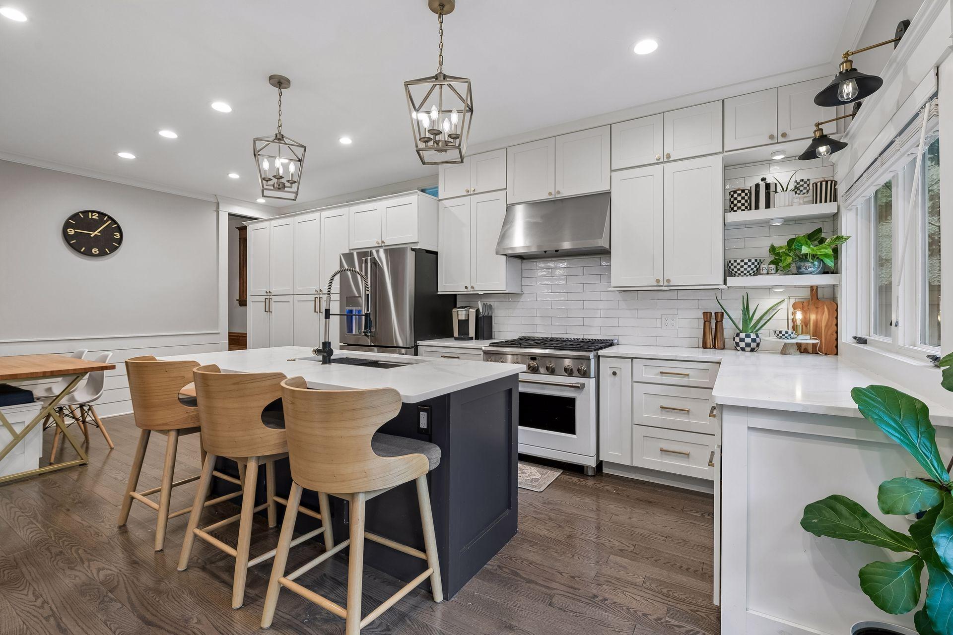 Updated kitchen with quartz countertops, new cabinetry, appliances and wood flooring.