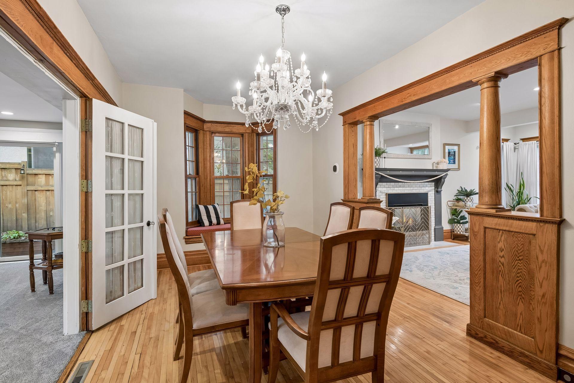 Formal dining room with hardwood floors, beautiful millwork and abundant natural light.