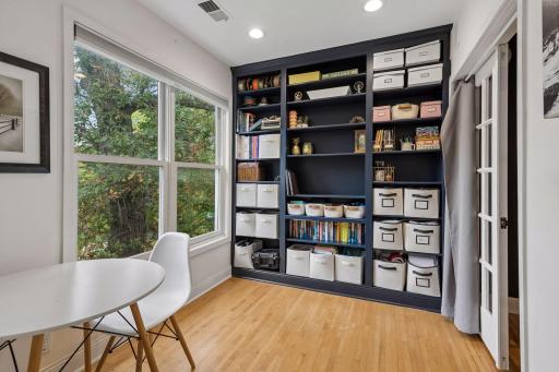 Custom built-in provide excellent storage in this light filled upper level room