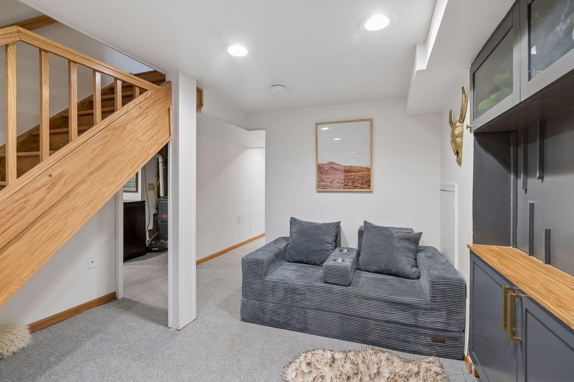 Updated lower level ads comfortable finish living space with new carpeting