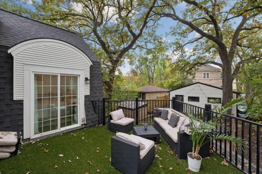 Upper deck offers another private outdoor space overlooking the backyard off of the primary