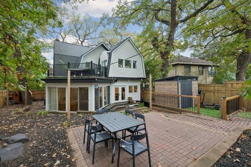 Backyard design for entertaining with dining patio and multiple seating areas