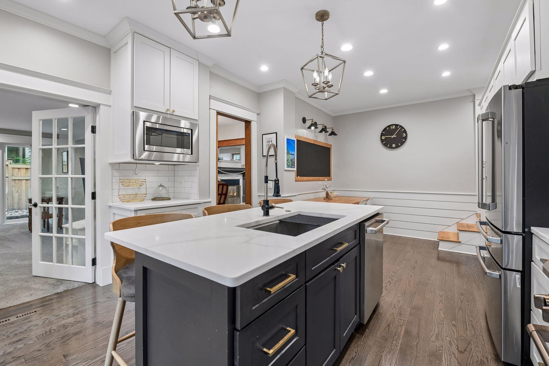 Large center island adds excellent workspace, storage and seating.