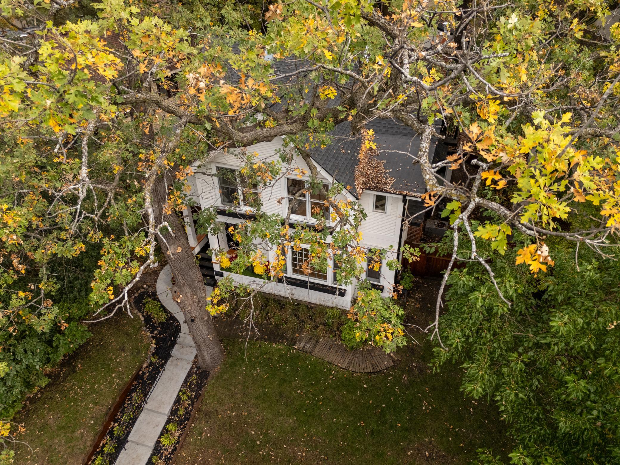 Tree filled Kenwood setting just moments away from lakes, parks, and trails