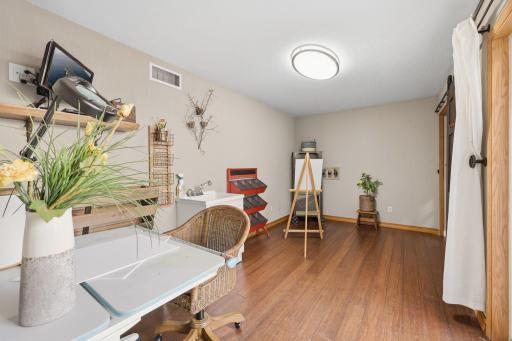 Let your creative juices flow in this sweet craft room complete with utility sink.