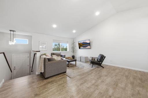 Bright and Inviting Living Room with Vaulted Ceilings