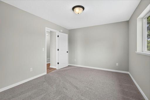 Bedroom 2. Photo taken of another home with similar plan and finishes.