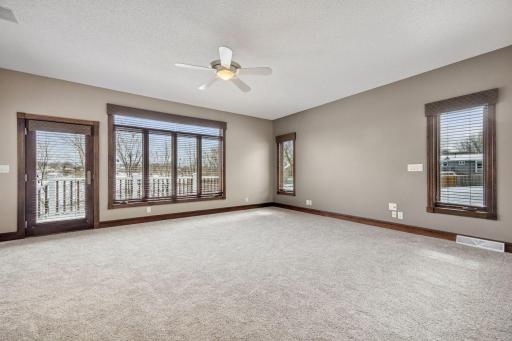Spanning 23Ã18, the main-level primary bedroom is a true retreat, offering sweeping views of nature and a spacious layout for comfort and style.