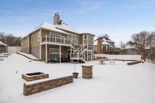 The backyard features a built-in firepit, perfect for relaxing while overlooking the pool.