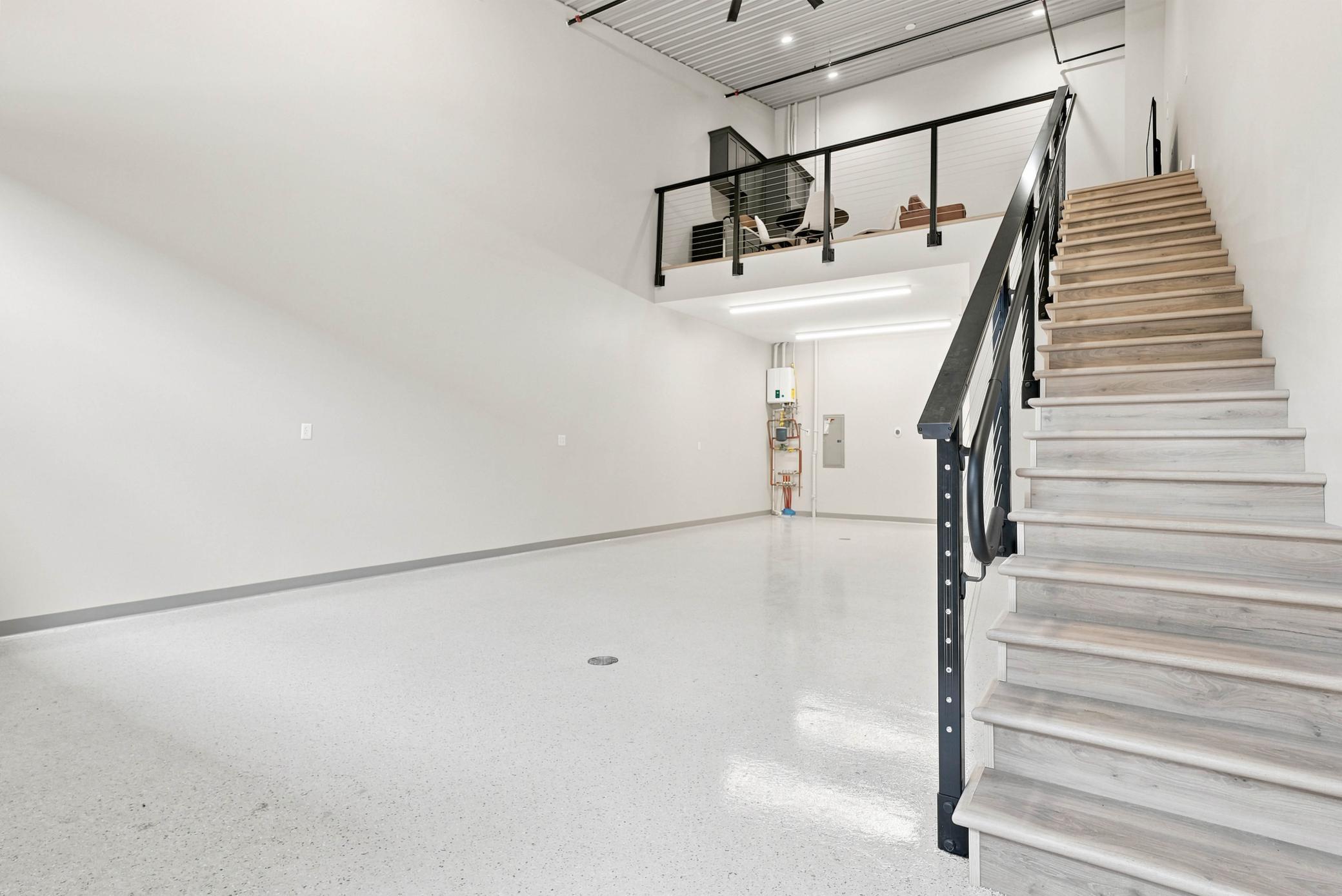 The mezzanine offers an additional level of storage, play, or office space.